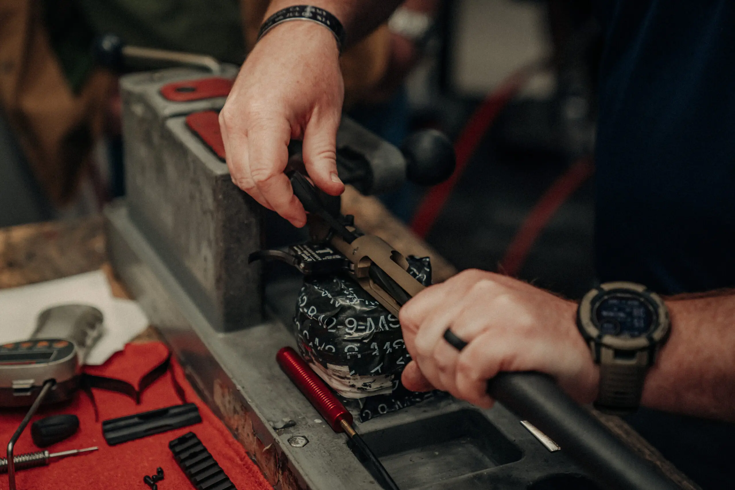 A Christensen Arms technician assembling a precision rifle