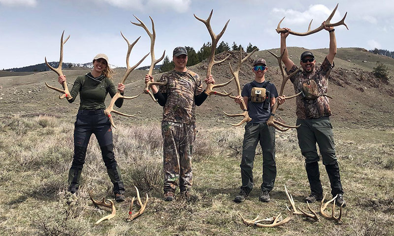 a group of shed hunters showing off their finds