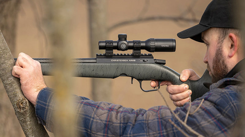 hunter holding the Christensen Arms Ranger rifle equipped with a Hawke Optics turkey scope