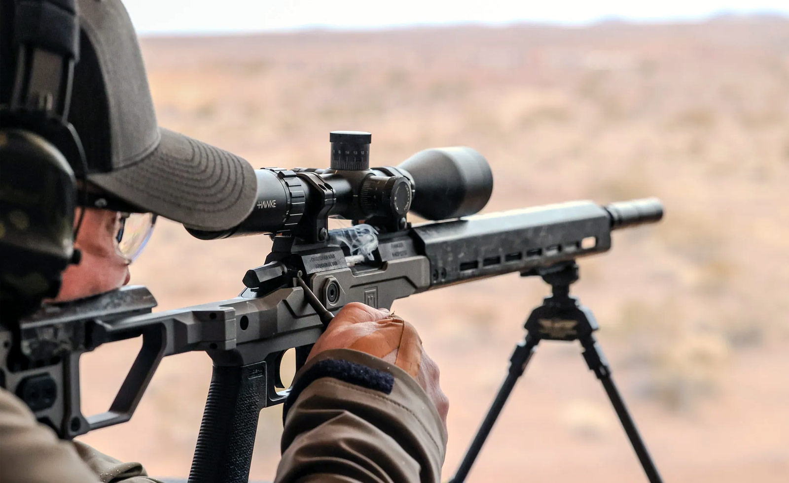A SHOT Show 2024 attendee shooting the Modern Precision Rifle Rimfire at Industry Day at the Range (IDATR)
