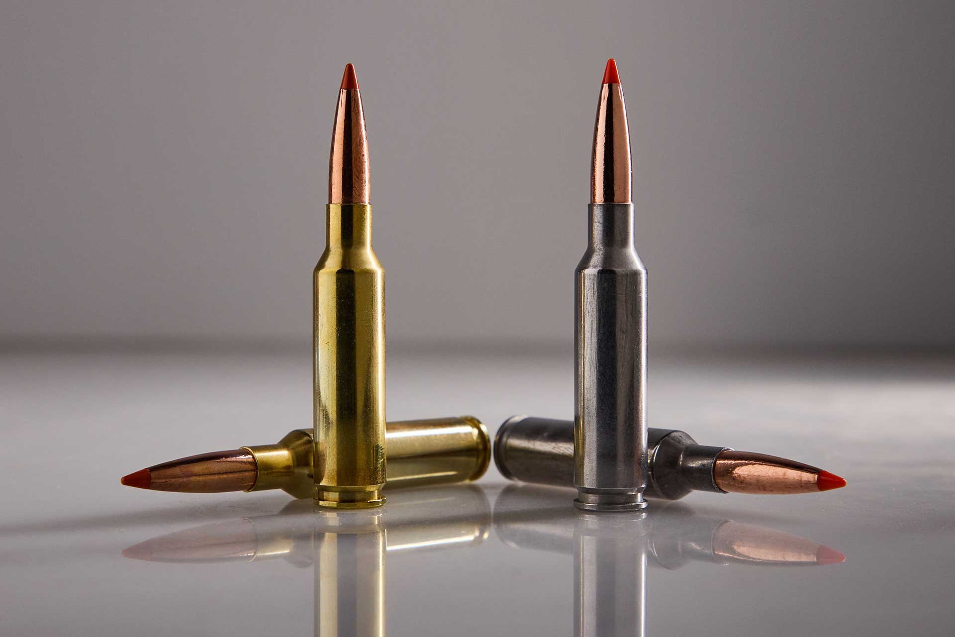 6.5 Creedmoor brass cartridge beside Federal Peak Alloy cartridge