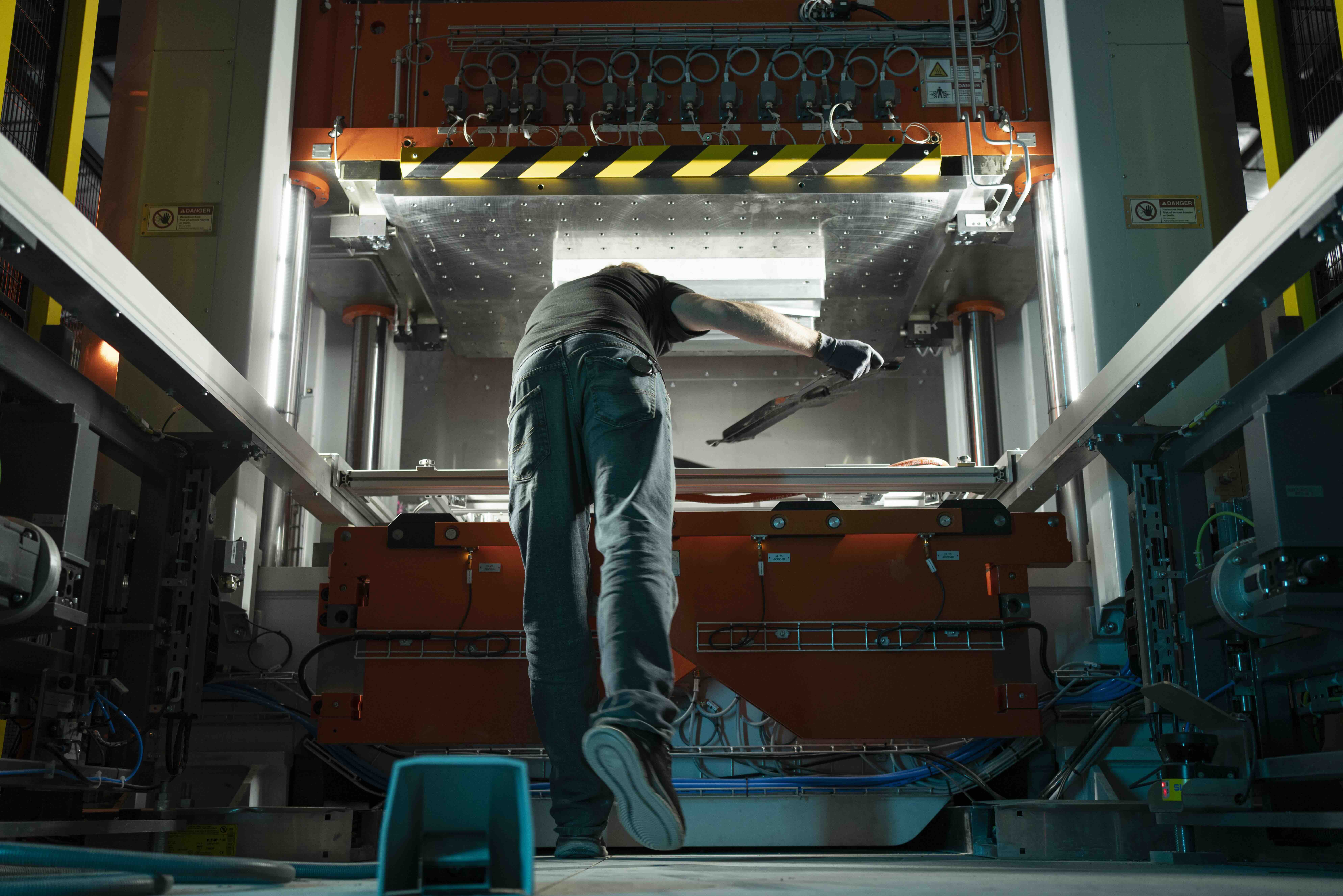 Christensen Arms team member working with manufacturing equipment
