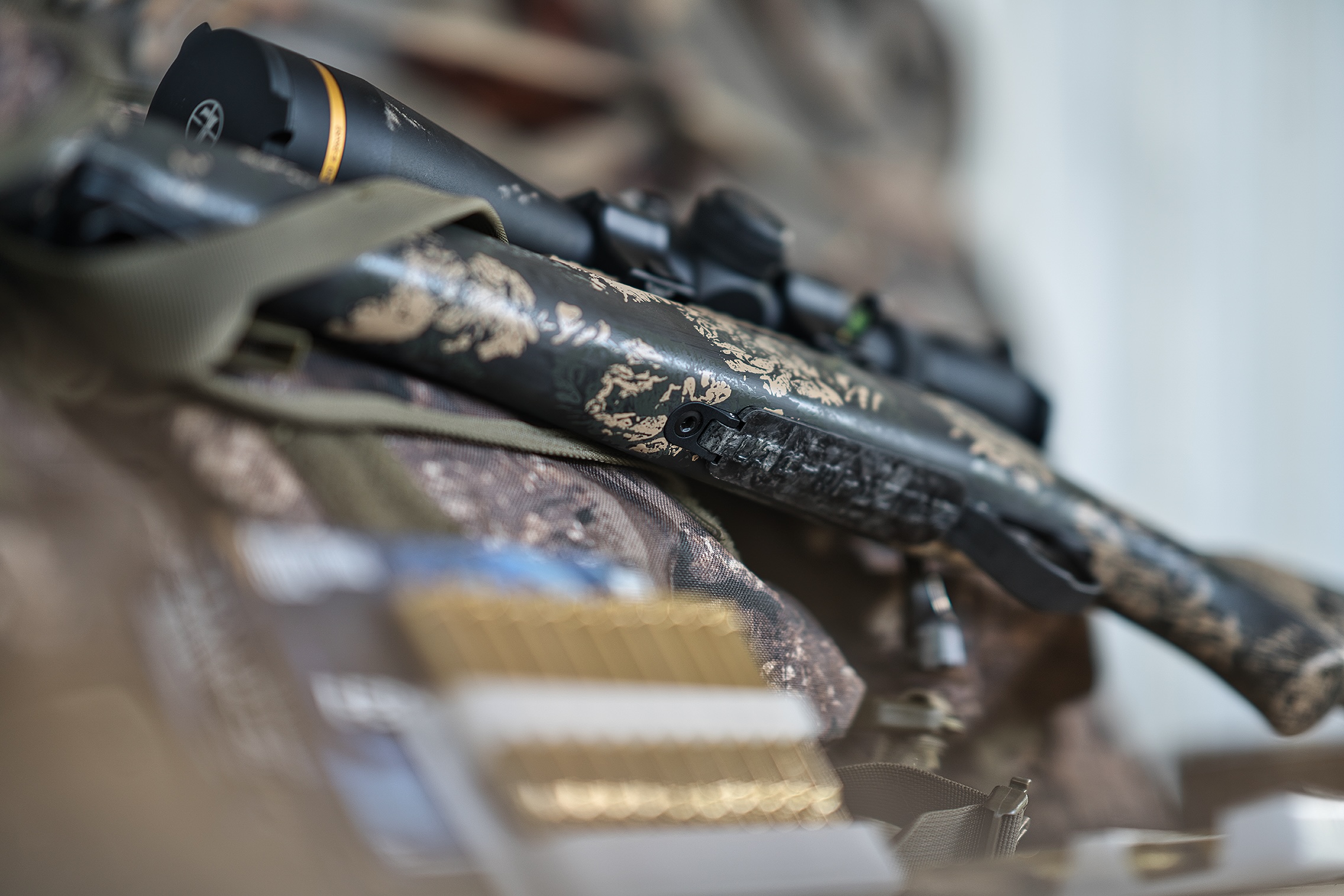 Close-up of a Christensen Arms carbon fiber rifle stock and optic