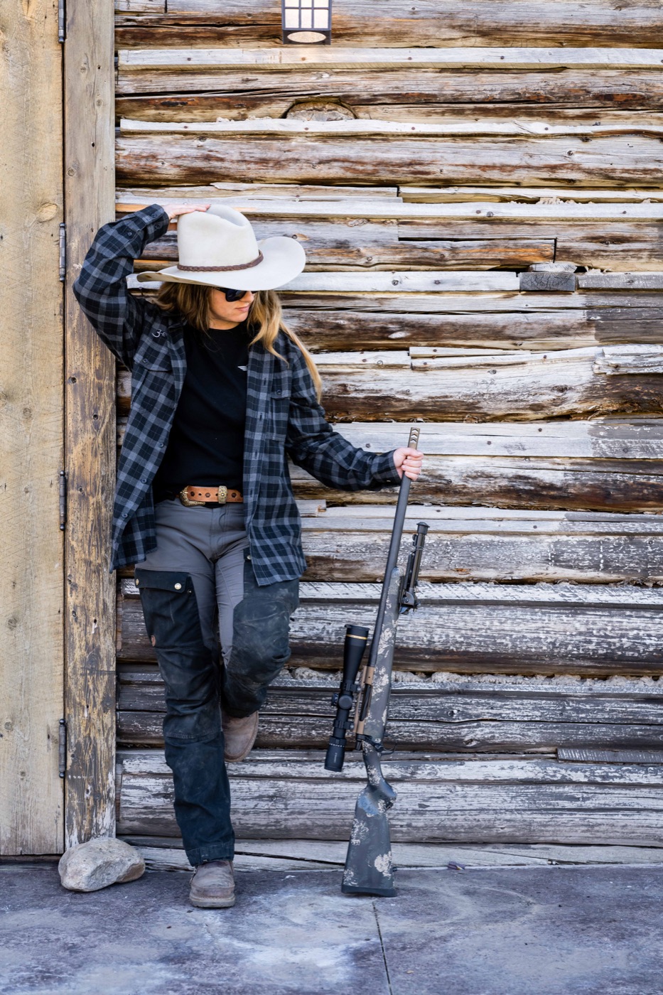 Hunter standing with a Christensen Arms hunting rifle