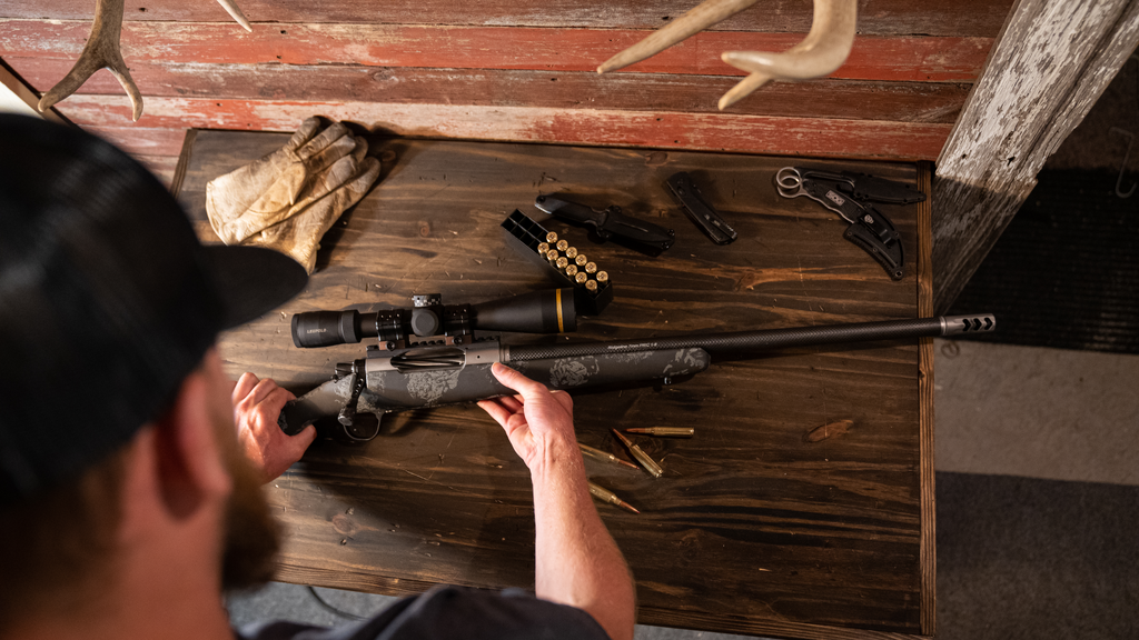 Christensen Arms Ridgeline FFT, optic, ammunition, and tools arranged to zero a hunting rifle